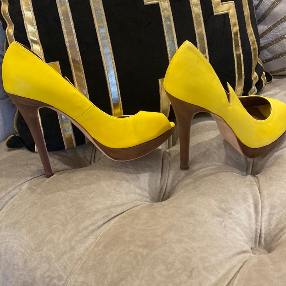 Yellow and brown never worn funky high heels.